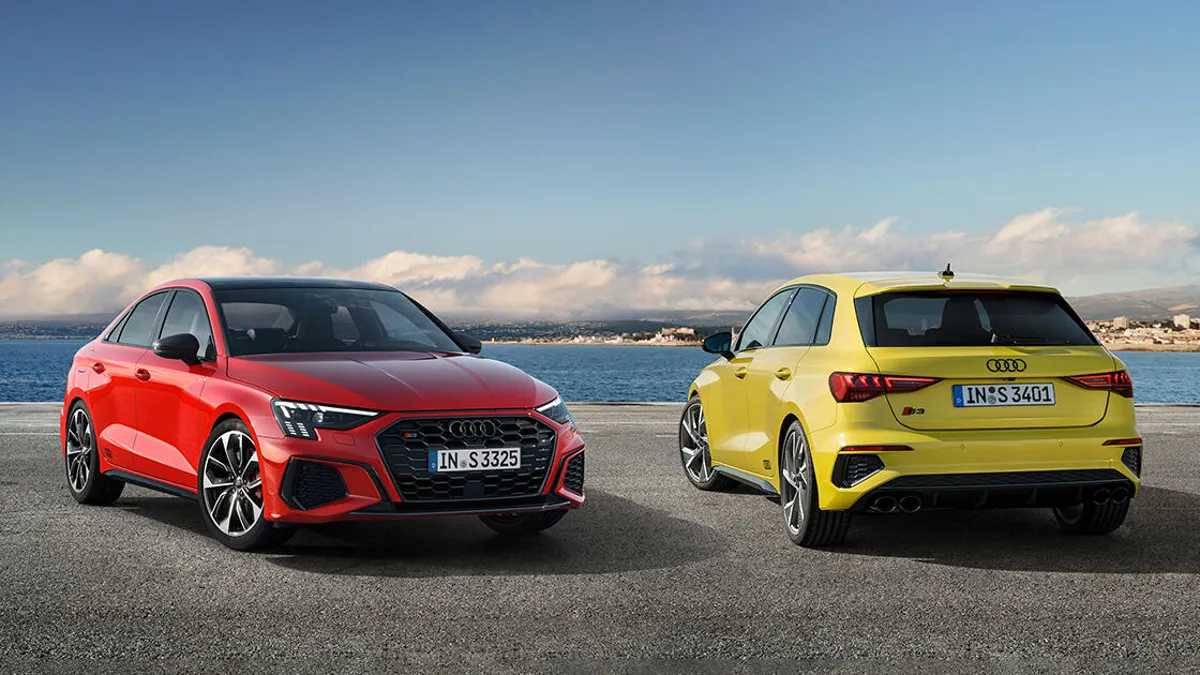 2 Audi car at a seaview.