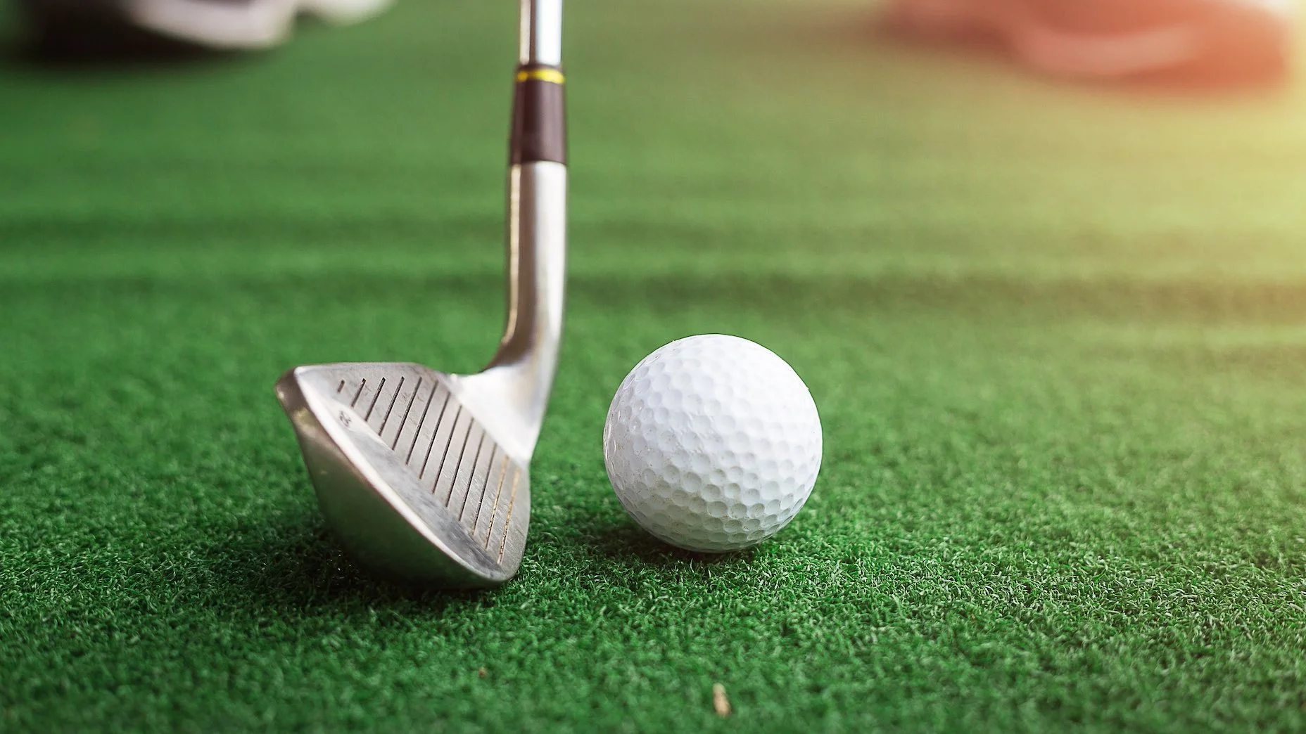 A golf stick with a ball.